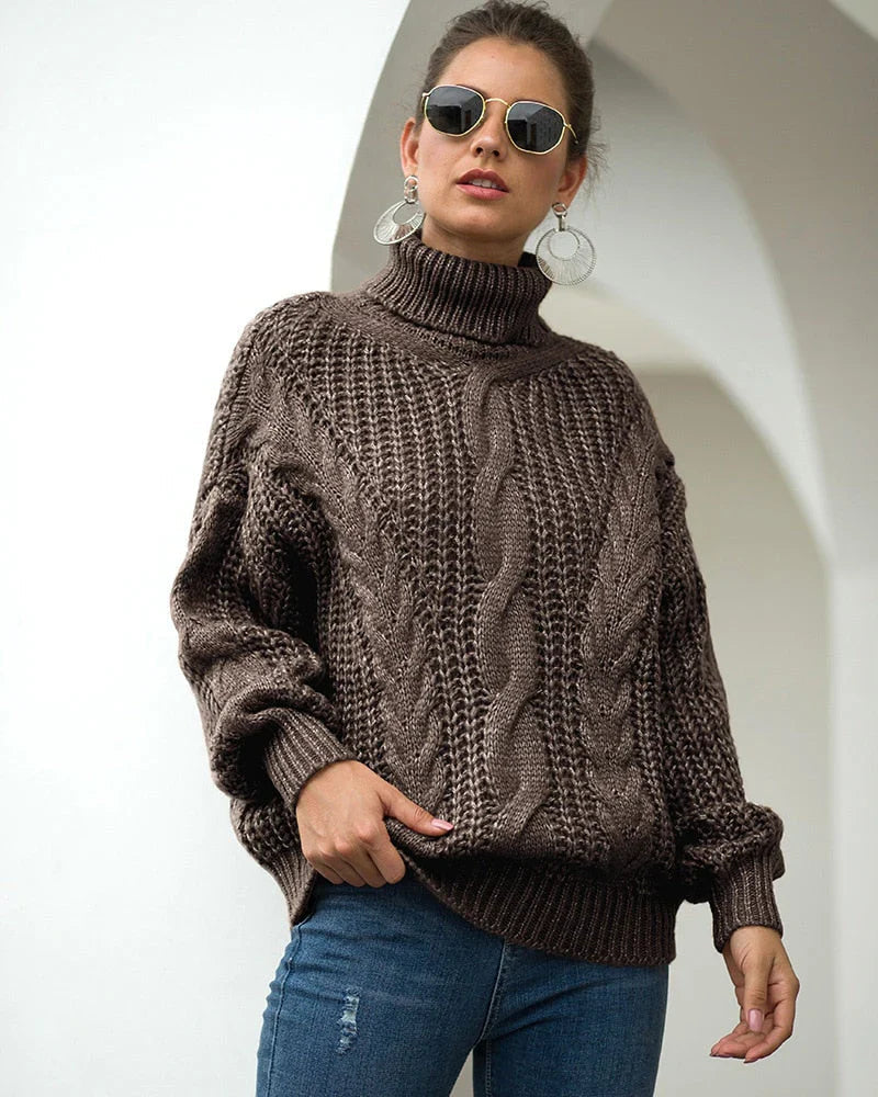 Maglione donna dolcevita a trecce con linea ampia